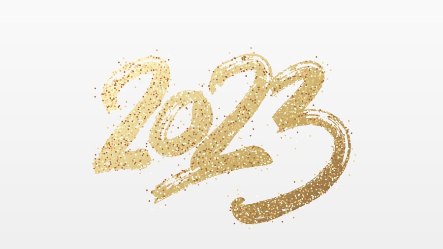 Die Zahl 2023 in schwungvoller goldener Schrift auf hellem Untergrund
